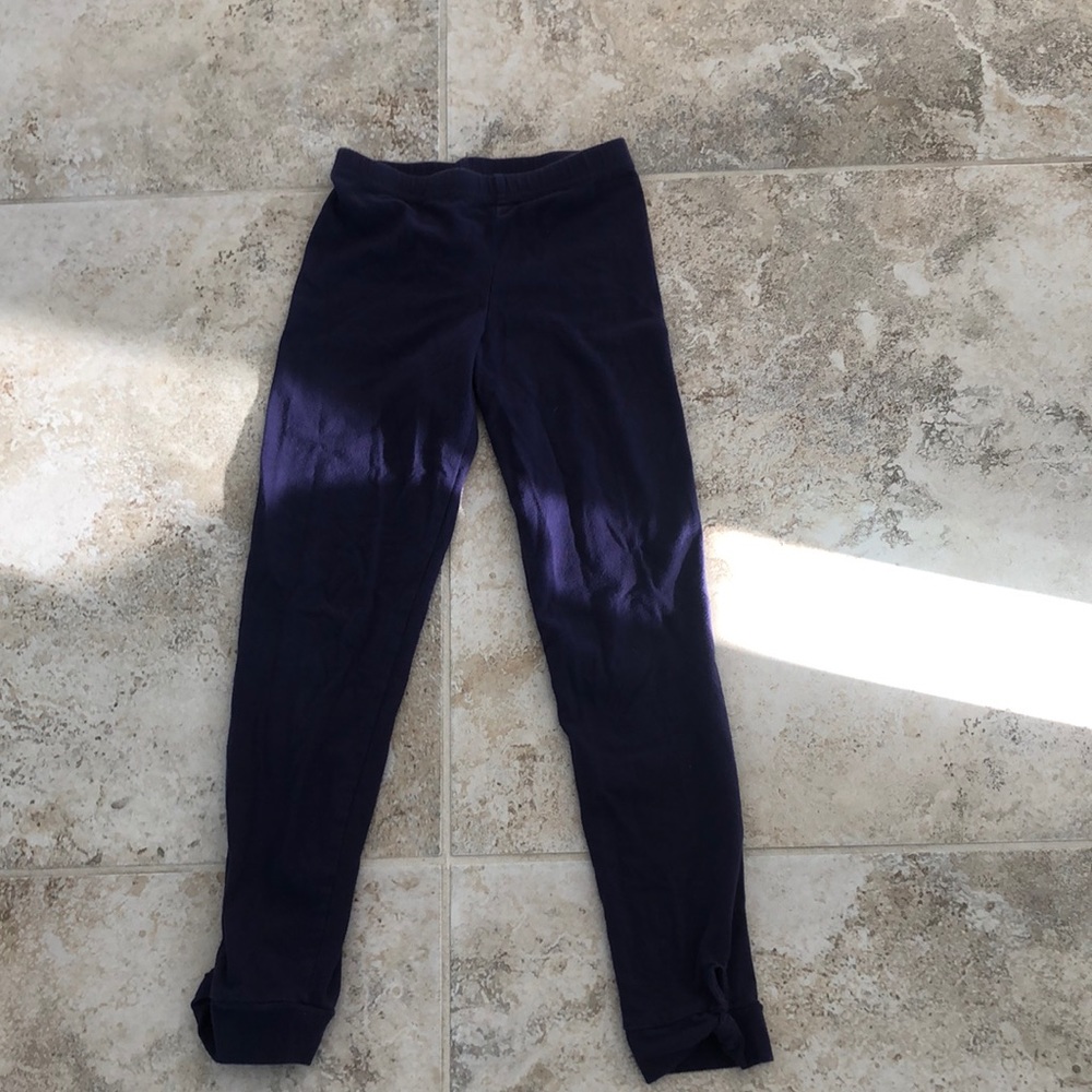 Long plain dark purple pants with twisted ruffles on the end good for school.